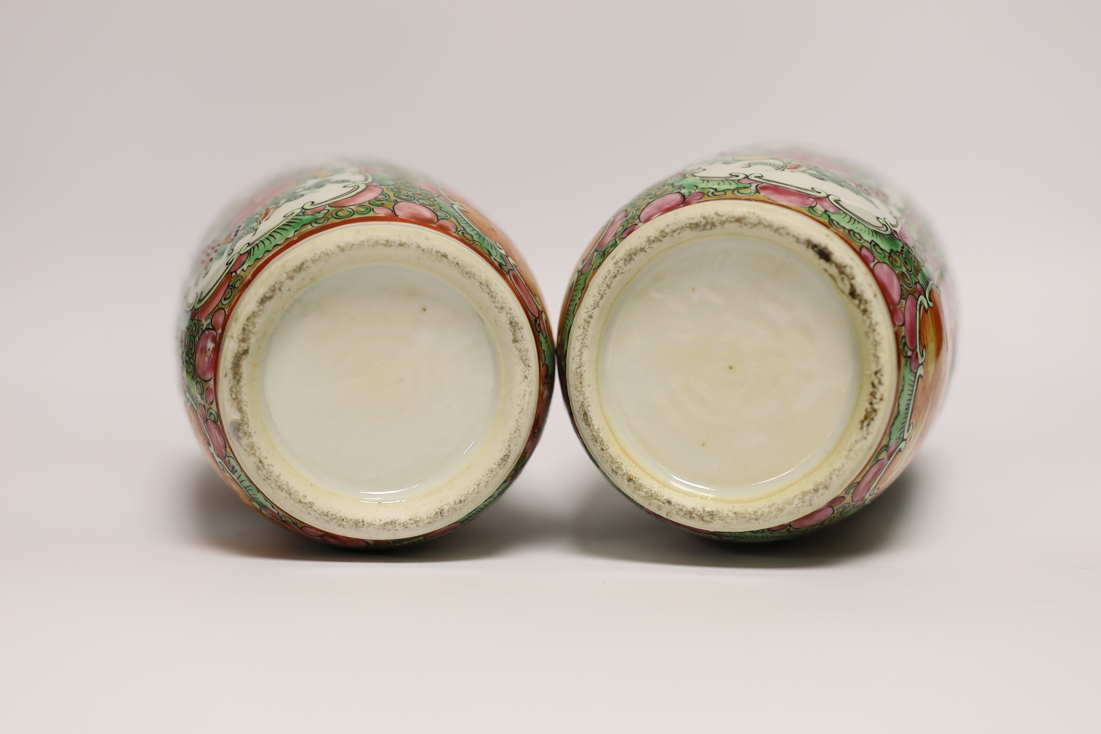 A pair of early 20th century Chinese famille rose vases, 26cm high